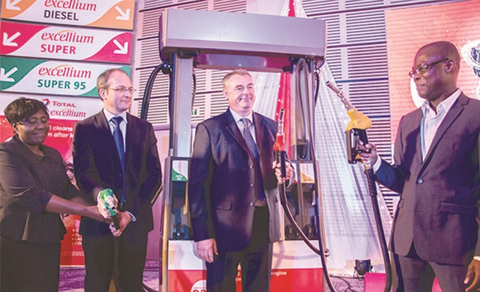 Fifi Kwetey (right) joins officials of Total to launch the product